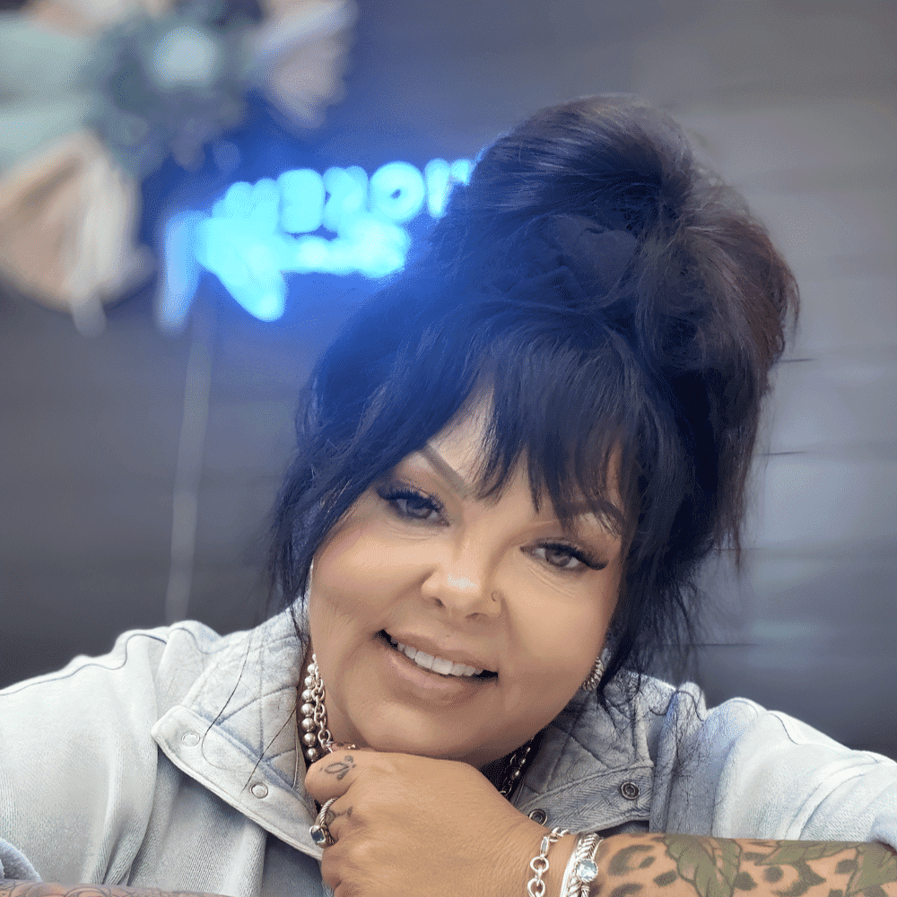 Portrait of Ashley Edwards, a professional stylist at The Wildflower Collective LLC, showcasing their expertise and style.