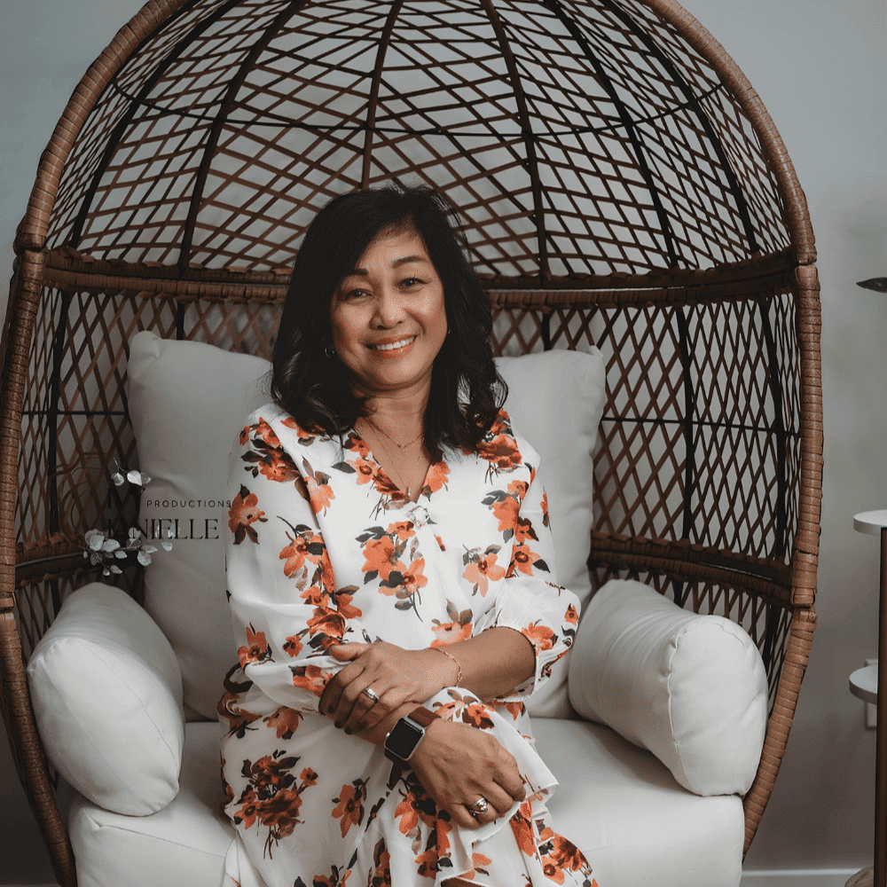 Portrait of Digna Scheffer, a professional stylist at The Wildflower Collective LLC, showcasing their expertise and style.